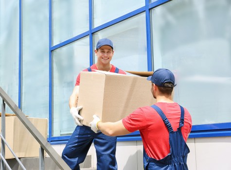 Moving boxes and furniture with a removals van in Finsbury