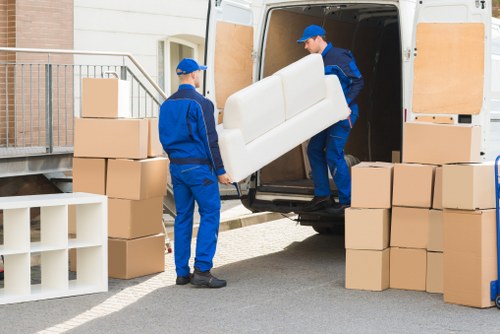 Careful wrapping of fragile household items during a packing service