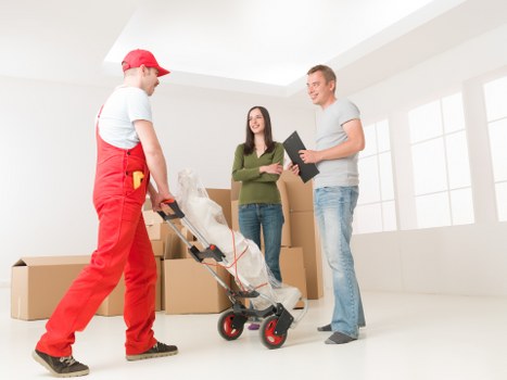 Local movers loading items into a truck in Finsbury