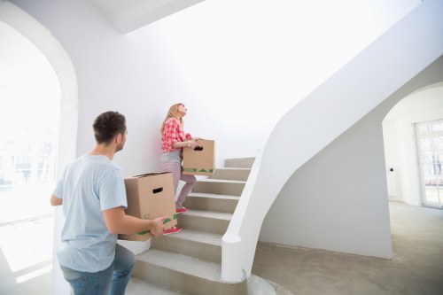 Office relocation scene with desks and equipment prepared for transport