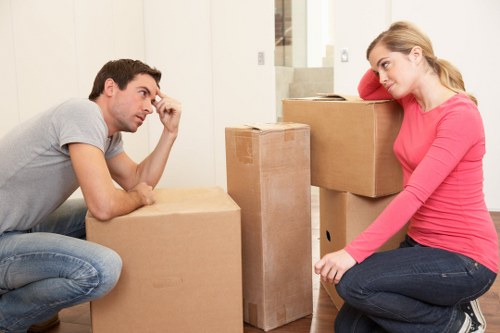 Packed office boxes and furniture ready for relocation in Finsbury