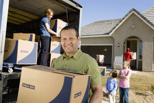 Professional man with van service focused on safety and careful handling